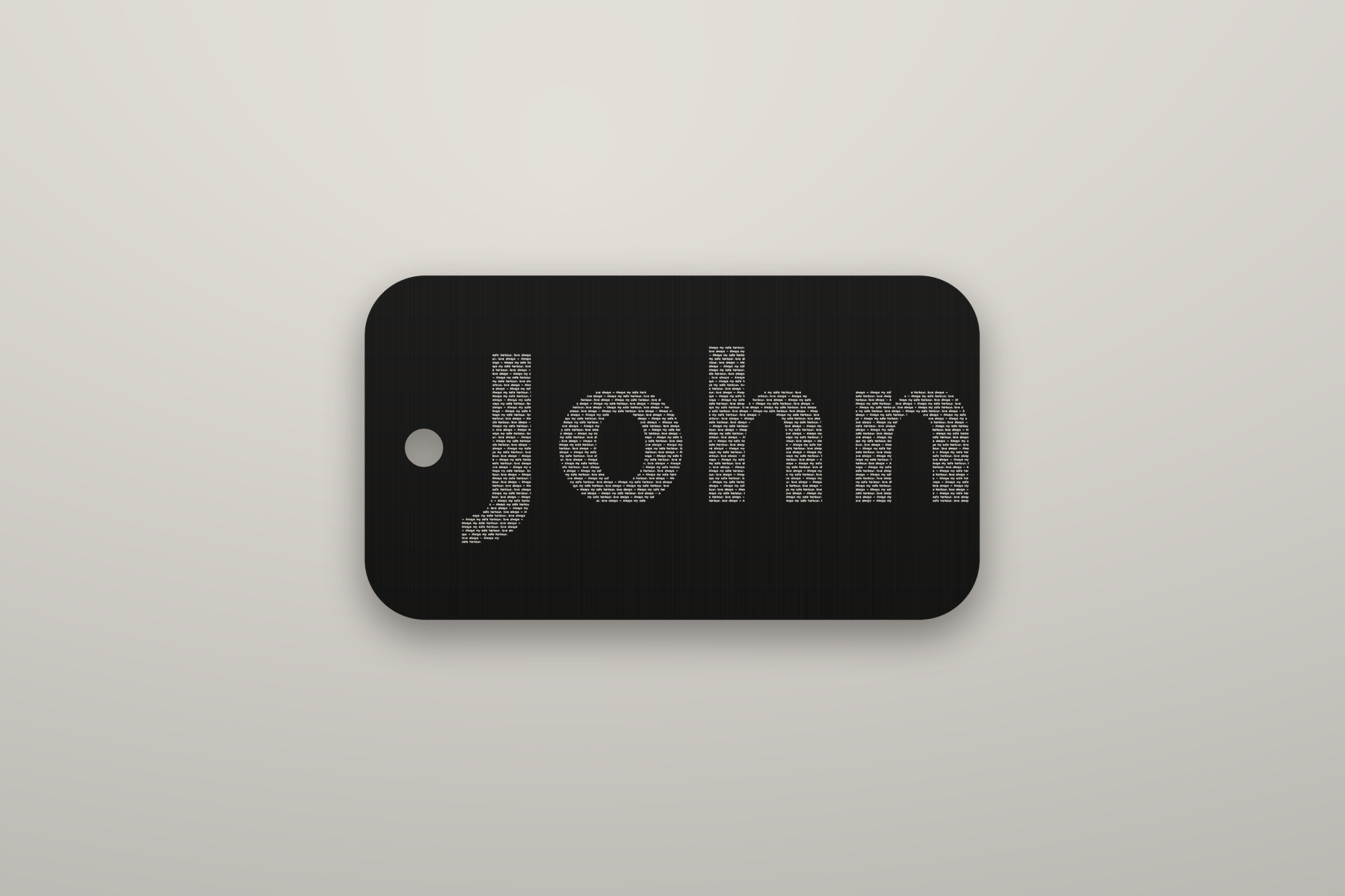 A name in microtext on the dog tag