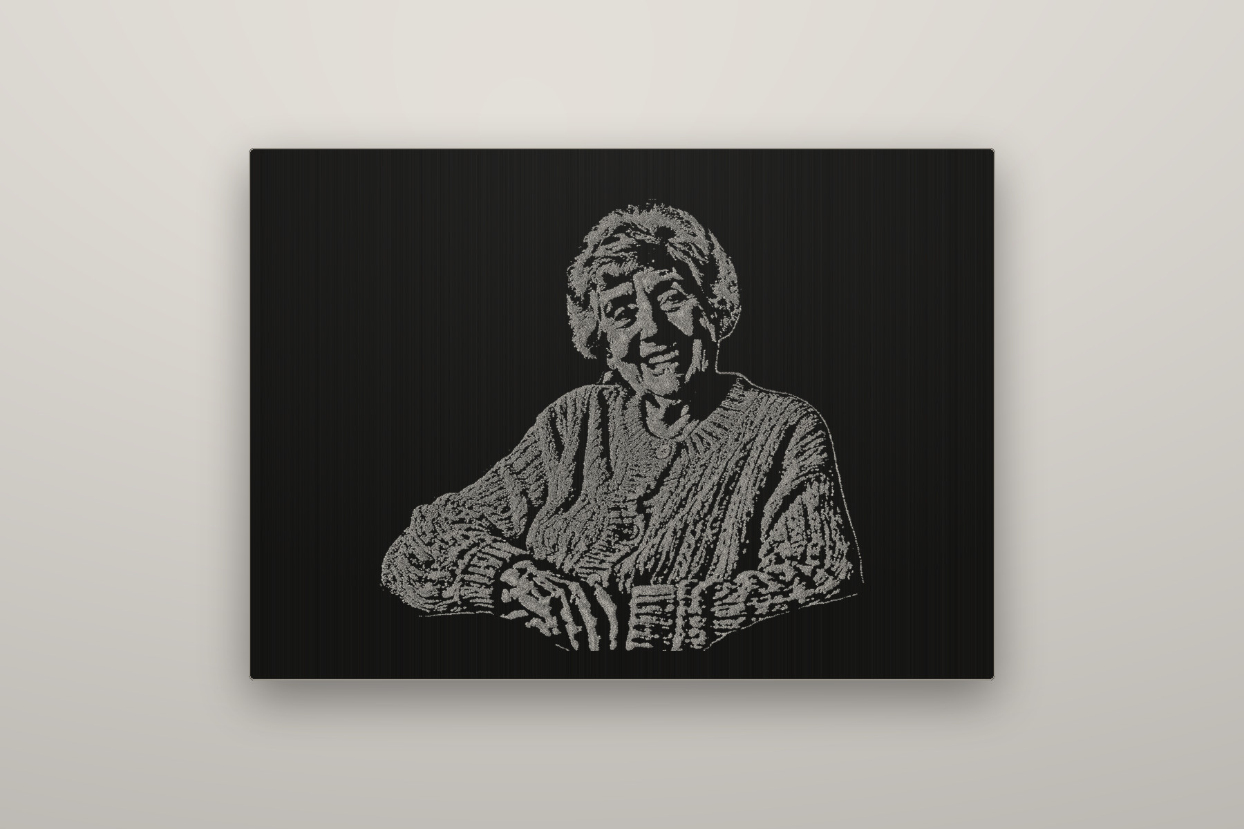 In Memoriam — text portrait in anodised